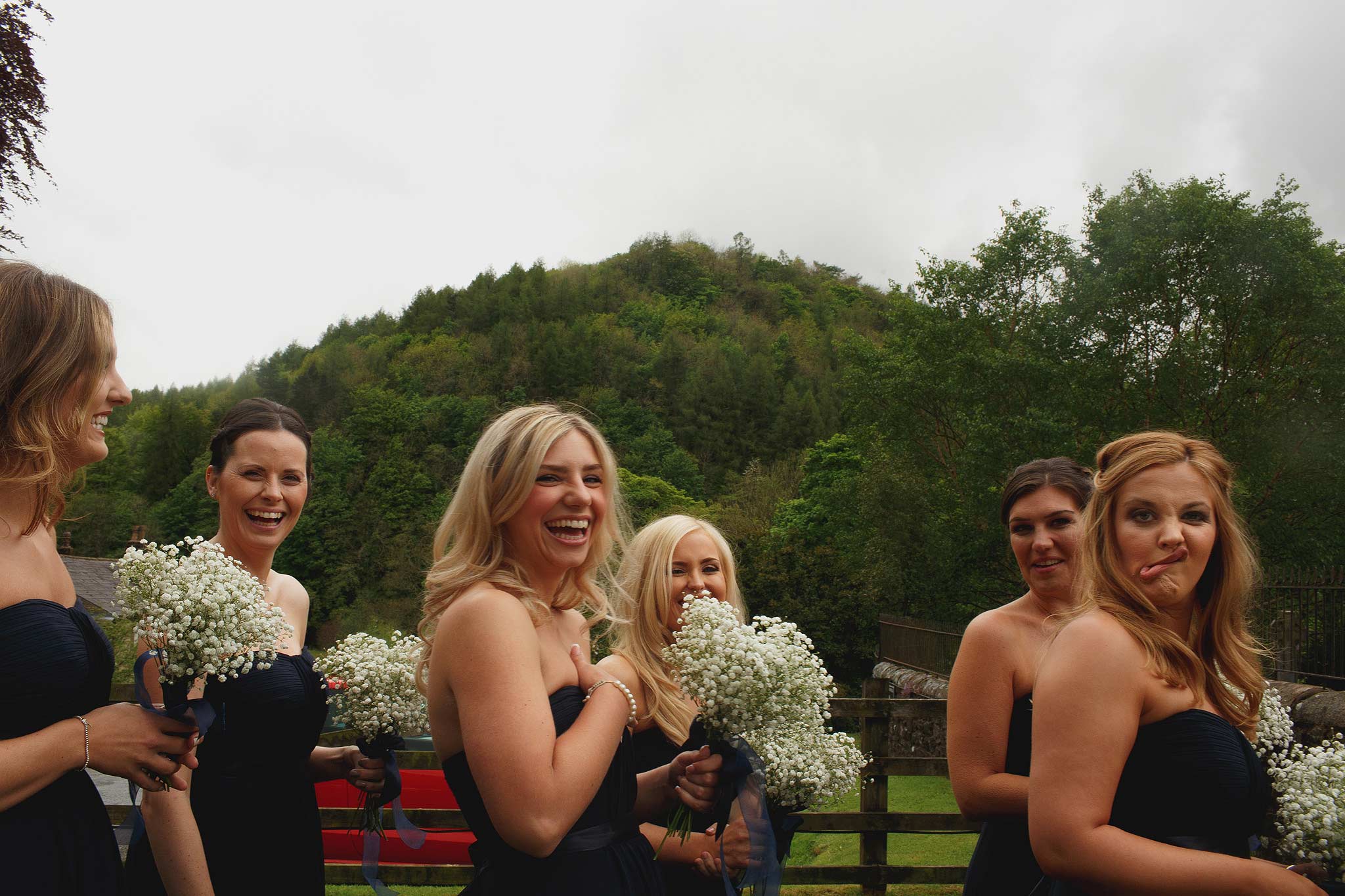 Bridesmaids outside the church next to Inn at Whitewell