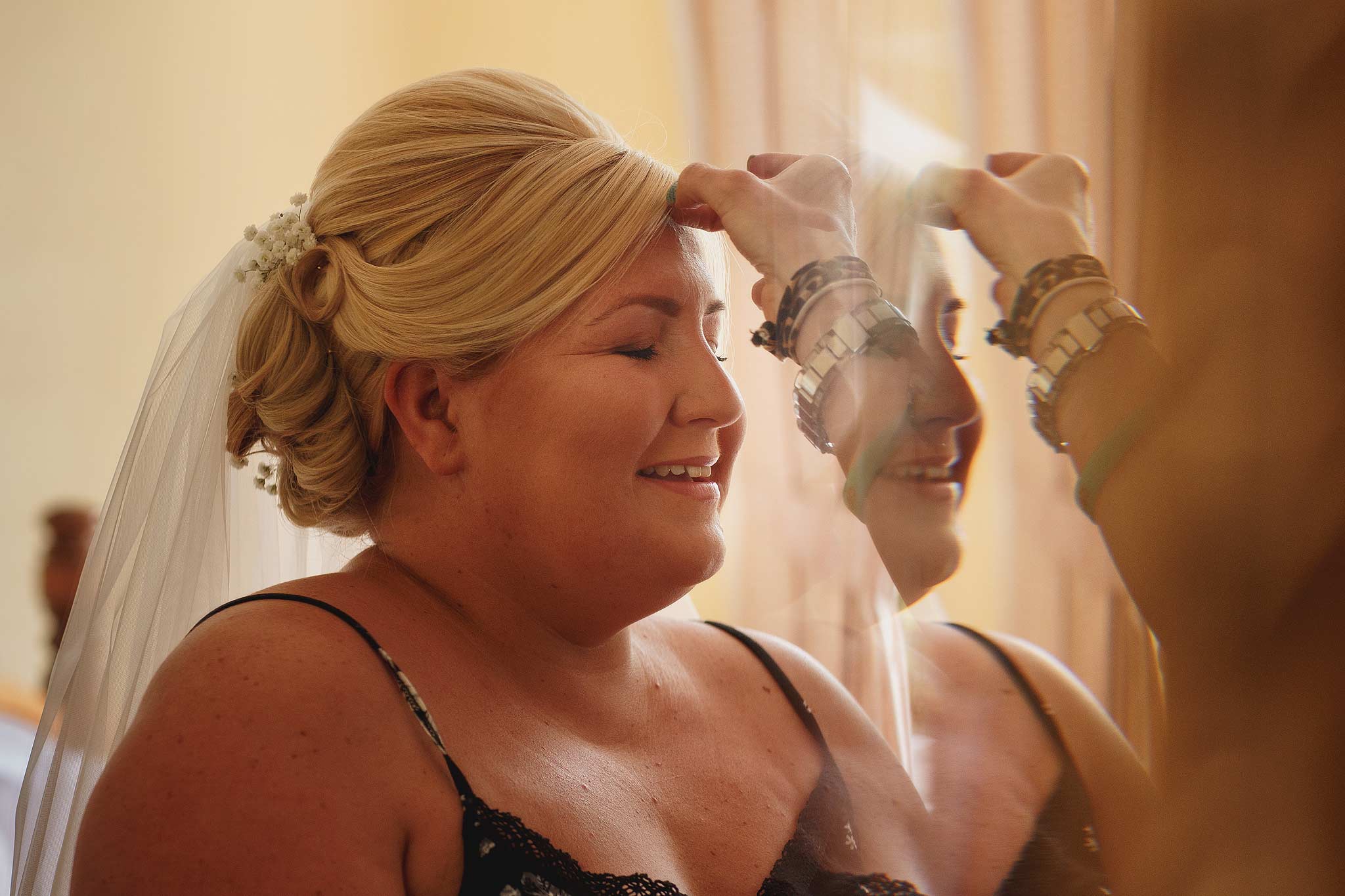Bride having make up applied 