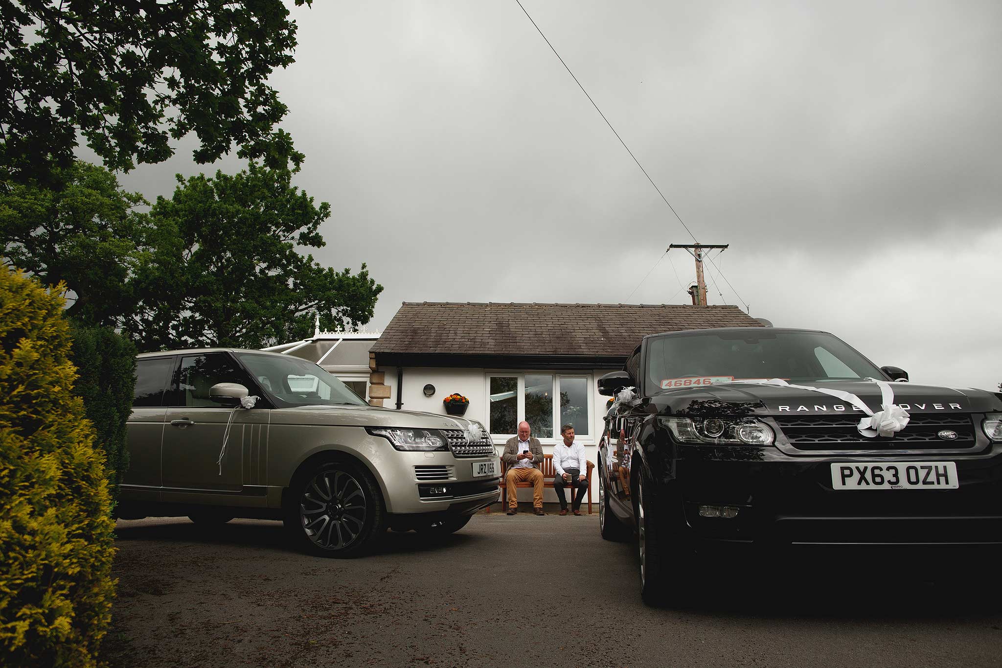 Wedding cars waiting outside the brides parents house