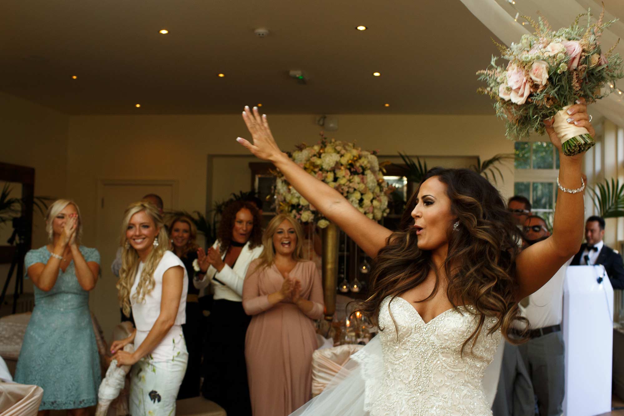 Bride partying as she enters the room at Mitton Hall Wedding