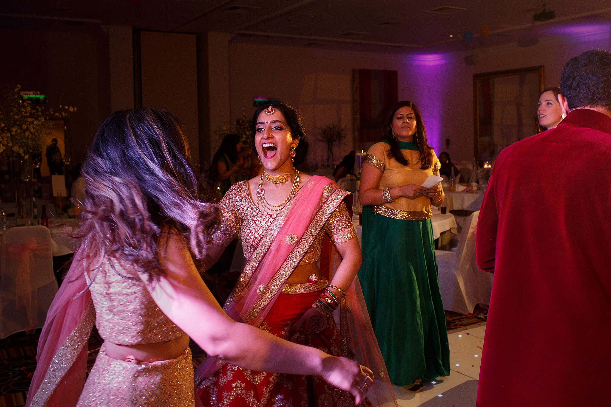 Bride dancing at Indian wedding reception