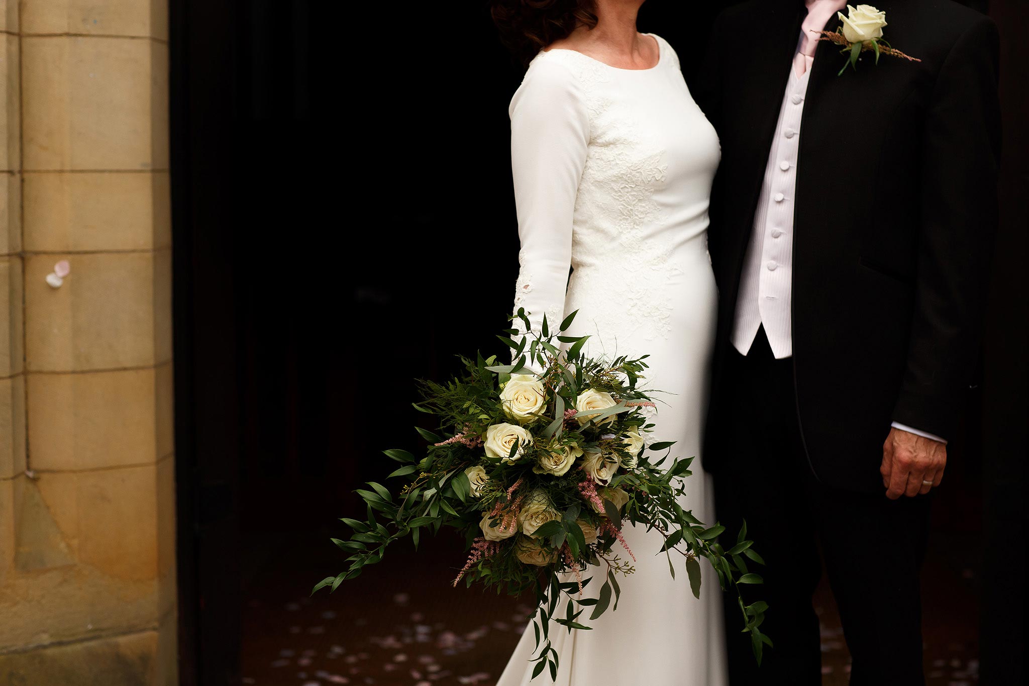 stylish creative image of bride and groom against a dark background