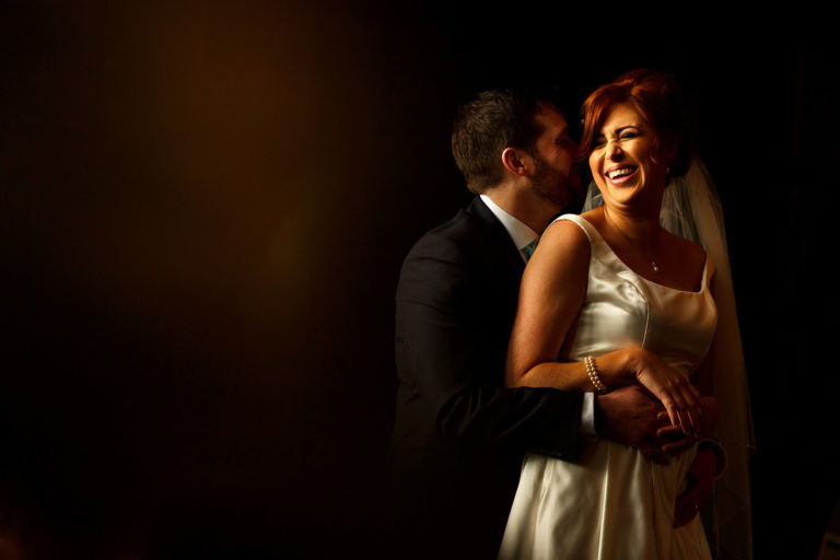 Bride with red hair and groom wedding portraits taken inside the Great Hall at Oakwell Hall