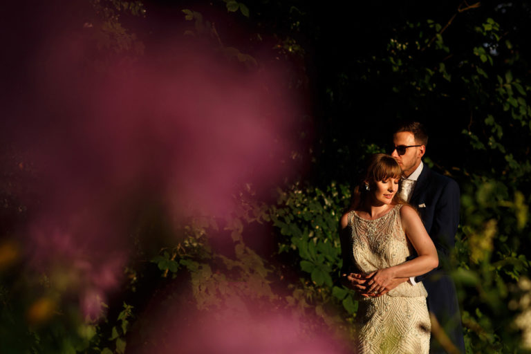 Sexy wedding day portrait of bride and groom in beautiful light in the gardens during wedding day portraits - The Villa at Wrea Green Wedding Photography - Toni Darcy Photography