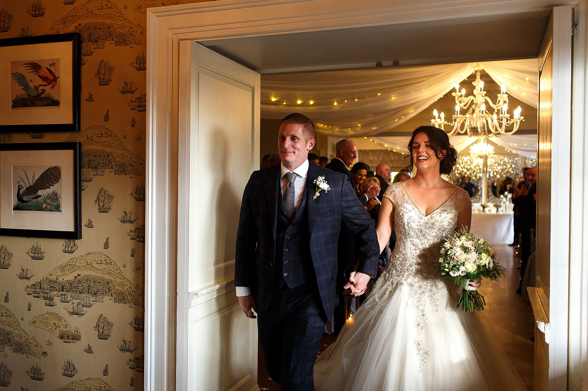 Bride and groom walking out of wedding ceremony | Eaves Hall wedding photography by Toni Darcy