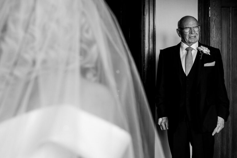 How to get the best reactions from your first look wedding photographs